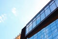 Low angle view of modern building with tinted windows against blue sky Royalty Free Stock Photo