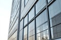 Low angle view of a modern office building with large glass windows Royalty Free Stock Photo