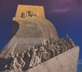 Low angle view of the Monument of the Discoveries under the sunlight during the sunset in Lisbon