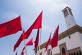 Low angle view of moroccan flags and a clock tower - Casablanca