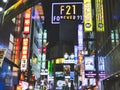 Low angle view of Neon lights and signs from the Shibuya district, Tokyo, Japan