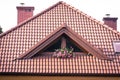 Low angle view of new house with wooden roof and gutter against clear blue sky.. Royalty Free Stock Photo