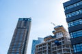 Low angle view of office buildings under construction in the City of London against blue sky Royalty Free Stock Photo