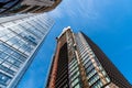 Low angle view of office buildings under construction in the City of London against blue sky. Royalty Free Stock Photo