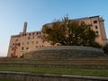 Low Angle View of the Oklahoma City National Memorial Museum, Survivor Tree with Fall Foliage, and Promontory Wall