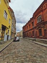 Low angle view of old town street with coblestone road Royalty Free Stock Photo