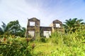 Old wooden house in the lush forest Royalty Free Stock Photo