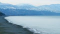 Pebble beach, surf. City embankment illuminated by lanterns. Kobuleti, Adjara, Georgia. Royalty Free Stock Photo