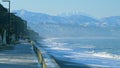 Pebble beach, surf. City embankment illuminated by lanterns. Kobuleti, Adjara, Georgia. Royalty Free Stock Photo