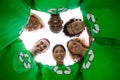 Low angle view of people wearing green shirt with recycling symbol on it Royalty Free Stock Photo