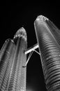 Low angle view of the Petronas Twin Tower or KLCC in the city with black and white dark moody color background.