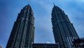 The low angle view of the Petronas Twin Towers or KLCC in the city with the clear blue sky during the day Royalty Free Stock Photo