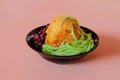 Low angle view of popular traditional local cold dessert cendol, shaved ice drizzled in gula melaka syrup with green noodles and Royalty Free Stock Photo