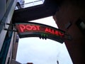 Low angle view of the Post Alley neon sign in downtown historic Pike Place Market