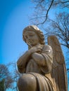 Low angle view of praying angel statue