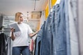 Low angle view of pretty saleswoman