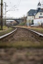 low-angle view of railway tracks curving towards a bridge.. Royalty Free Stock Photo