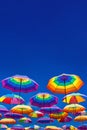 Low Angle View Of Rainbow Colored Umbrellas Hanging On The Background Of A Blue Sky Royalty Free Stock Photo