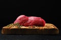 Low angle view of raw beef steak tri tip loin on cutting board Royalty Free Stock Photo