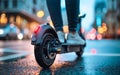 Low angle view of the rear wheel of an electric scooter