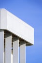 rectangle porch columns on terrace of white modern house building against blue sky Royalty Free Stock Photo