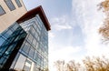 Low angle view of reflection of blue sky in glass wall of modern Royalty Free Stock Photo