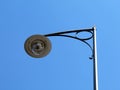 low angle view of retro style lamppost head. closeup detail. clear blue sky