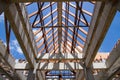 Low angle view of roof trusses and framing wooden of new house c Royalty Free Stock Photo