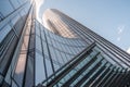 Low angle view of round tower skyscrapers. Abstract round blue skyscraper buildings in sun lights