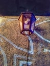 A lantern hanging on a wall, illuminated by soft light Royalty Free Stock Photo