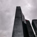 Low-angle view of skyscrapers under the cloudy sky in Singapore's central business district Royalty Free Stock Photo