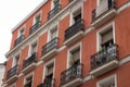 Low angle view of small balconies residential building facade in Madrid Royalty Free Stock Photo