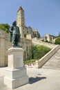 The statue of DÃ¢â¬â¢Artagnan in front of the monumental staircase leading to the Tower of Armagnac in Auch Royalty Free Stock Photo