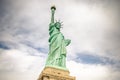 Low Angle View of Statue of Liberty Enlightening the World. New York City, USA. Blue Skye with Clouds in Background Royalty Free Stock Photo