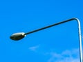 Low angle view of street light against blue sky Royalty Free Stock Photo