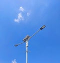 Low angle view of street light against blue sky Royalty Free Stock Photo