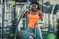 Strong woman exercising with battle ropes during functional training Royalty Free Stock Photo