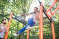 Strong young man doing amazing pull-up variation during extreme