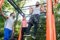 Strong young man doing chin-up repetitions during calisthenics w