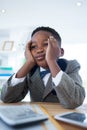 Low angle view of thoughtful businessman with head in hands Royalty Free Stock Photo