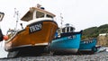 Low angle view of traditional Cornish fishing boats on the beach at Cadgwith Royalty Free Stock Photo