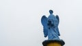 Low angle view of a transparent statue of blue angel. Religion or LGBTQ symbol. Transgender concept