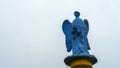 Low angle view of a transparent statue of blue angel. Religion or LGBTQ symbol. Transgender concept