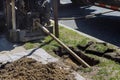 Low angle view of trenchless laying of communications, pipes and water pipes with horizontal directional drilling