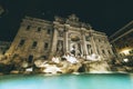 Low angle view of the Trevi Fountain surrounded by the lights at night in Rome, Italy Royalty Free Stock Photo