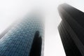 Low angle view of two skyscrapers shrouded in fog or mist in the banking district of Frankfurt Germany Royalty Free Stock Photo