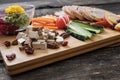 Low angle view of vegan snack or appetizer served on wooden board