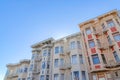 Low angle view of victorian apartment buildings with emergency stairs in San Francisco, CA