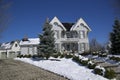 Low angle view of the Victorian style house with deep snow in winter Royalty Free Stock Photo