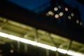 Low angle view of walkway overpass and condominium in the night.light yellow.blur bokeh background.